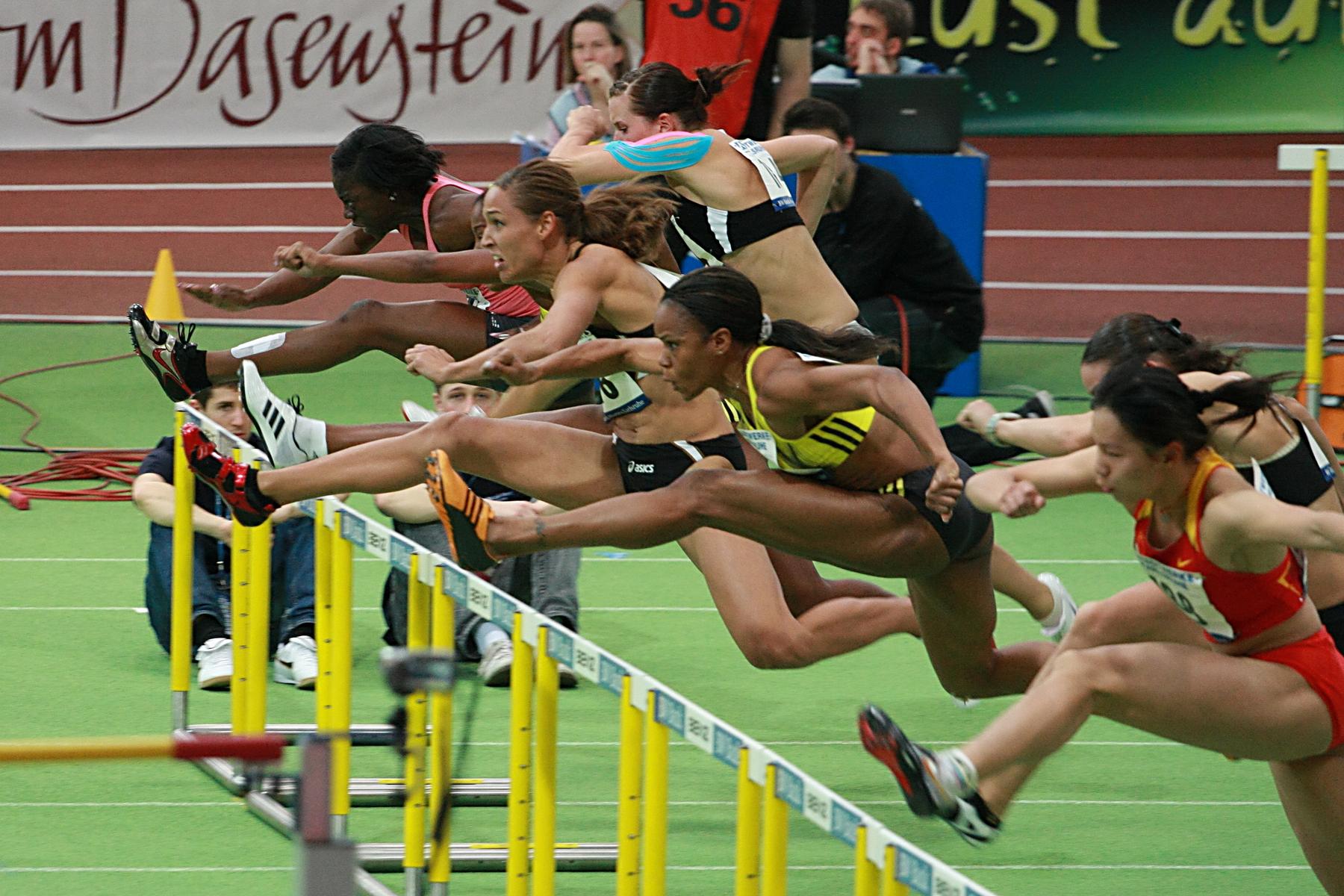 a group of women competing in the women's 100m race - 60m Hurdles (4328764916)